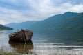 Old boat on the hazy lake