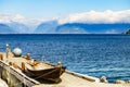 Old boat on pier, norway fjord Royalty Free Stock Photo