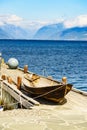 Old boat on pier, norway fjord Royalty Free Stock Photo