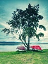 Old boat for rent  the old iron holder on the river bank Royalty Free Stock Photo