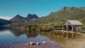 old boat shed at dove lake with cradle mt in the distance Royalty Free Stock Photo