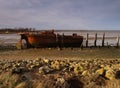 Old Boat shipwreck at sunset Royalty Free Stock Photo