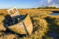 Old boat wreck abandoned in marshland