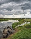 Old boats on the bank of a small river. Stitched Panorama Royalty Free Stock Photo