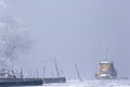 Old boats frozen in ice on River Danube mid winter Royalty Free Stock Photo