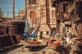 Old boats and gondolas for repair inside courtyard of the Squero, gondola boatyard