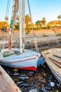 Old boats moored in dirty harbour. Pollution of river, sea, ocean water with waste, plastics garbage. Royalty Free Stock Photo