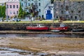 Old boats on the pier of the port of Clifden at low tide Royalty Free Stock Photo