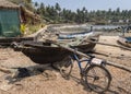 Old boats and rusty bike near the village on the Indian ocean