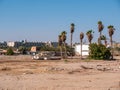 Old boats on the sandy shore against the sky and palms Royalty Free Stock Photo