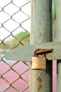 Old bolt and padlock on the door tennis court Royalty Free Stock Photo