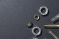 Old bolts and nuts on a dark background. Royalty Free Stock Photo