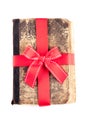 Old book as a gift with red ribbon Royalty Free Stock Photo