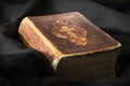 Old book on black background. Ancient christian Bible. Antique H Royalty Free Stock Photo