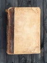 Old book with blank cover on the wooden table Royalty Free Stock Photo