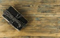 Old book bound by a new shiny chain on dark background Royalty Free Stock Photo