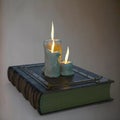 Old book and candles Royalty Free Stock Photo