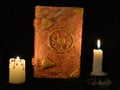 Old book of fairy tales with candles