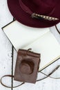 Old book and feather pen on vintage white wooden table Royalty Free Stock Photo