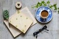 Old book, glasses, cup of coffee and an envelope on the table. Vintage still life Royalty Free Stock Photo