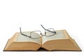 Old, book or glasses with manuscript of knowledge, ancient literature or history on a white studio background. Closeup Royalty Free Stock Photo