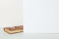 An old book and glasses on the table, on a white background, the concept of reading and learning. Copy space Royalty Free Stock Photo