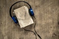 Old book and headphones Royalty Free Stock Photo