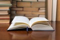 Old book in library with open textbook, stack piles of literature text archive on reading desk in school study class room Royalty Free Stock Photo