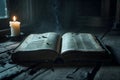An old book lies open on an old table by candlelight Royalty Free Stock Photo