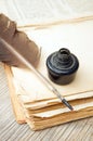 Old book, quill and black ink Royalty Free Stock Photo