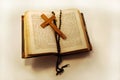 Old book, rosary and cross Royalty Free Stock Photo