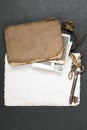 Old book, rusty key and empty photograph Royalty Free Stock Photo