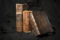 Old book spines on black background. Ancient library. Antique Ho