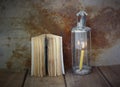 Old book and vintage lamplight on wooden table Royalty Free Stock Photo