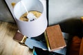 Old book and white lamp on bedside table Royalty Free Stock Photo