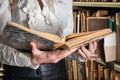 Old book in woman hands. concept of wisdom, reading, imagination