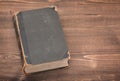 Old book on wooden background Royalty Free Stock Photo