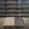 Old book on wooden table with blur bookshelfs background