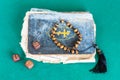 Old book, worry beads and dices with six points Royalty Free Stock Photo