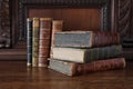 Old books on an antique wooden furniture Royalty Free Stock Photo