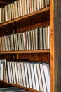 Old books on an archival shelf of library. Royalty Free Stock Photo