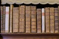 Old books on bookshelf in ancient Palatina Library in Parma