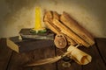 Old books, candle and feather amulet with ink Royalty Free Stock Photo