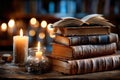 Old Books and Candles on a Wooden Table in a Library Royalty Free Stock Photo
