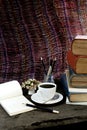 Old books coffee cup, compass and pencil on a wooden. Royalty Free Stock Photo