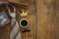 old books, glitter crown, necktie and cup of coffee. Father& x27;s day concept