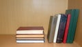 Old books lie and stand on a shelf in a wooden bookcase. Reading, classic literature Royalty Free Stock Photo