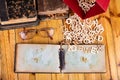 Old books and a notebook on a wooden table. Letters cut from wood arranged on an old notebook Royalty Free Stock Photo