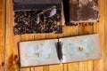 Old books and a notebook on a wooden table. Place of work of an elderly man