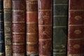 Close up on old books on an antique wooden furniture Royalty Free Stock Photo